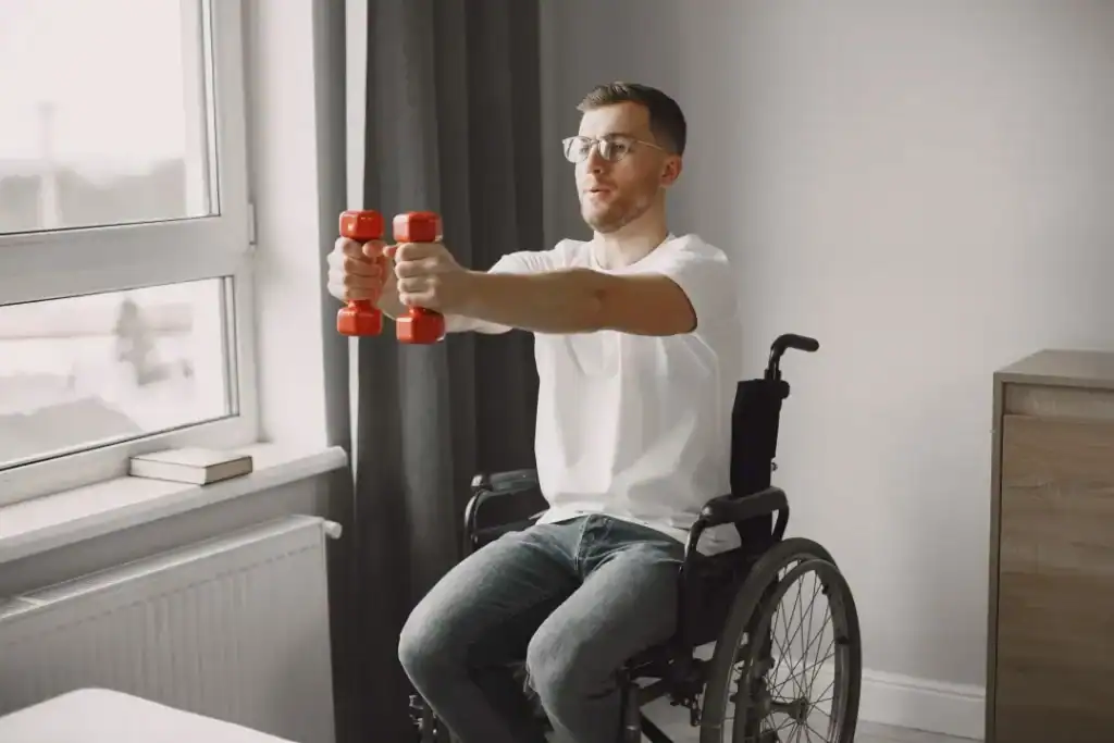 Image of man doing exercise in his wheelchair to aid weight loss East Kilbride