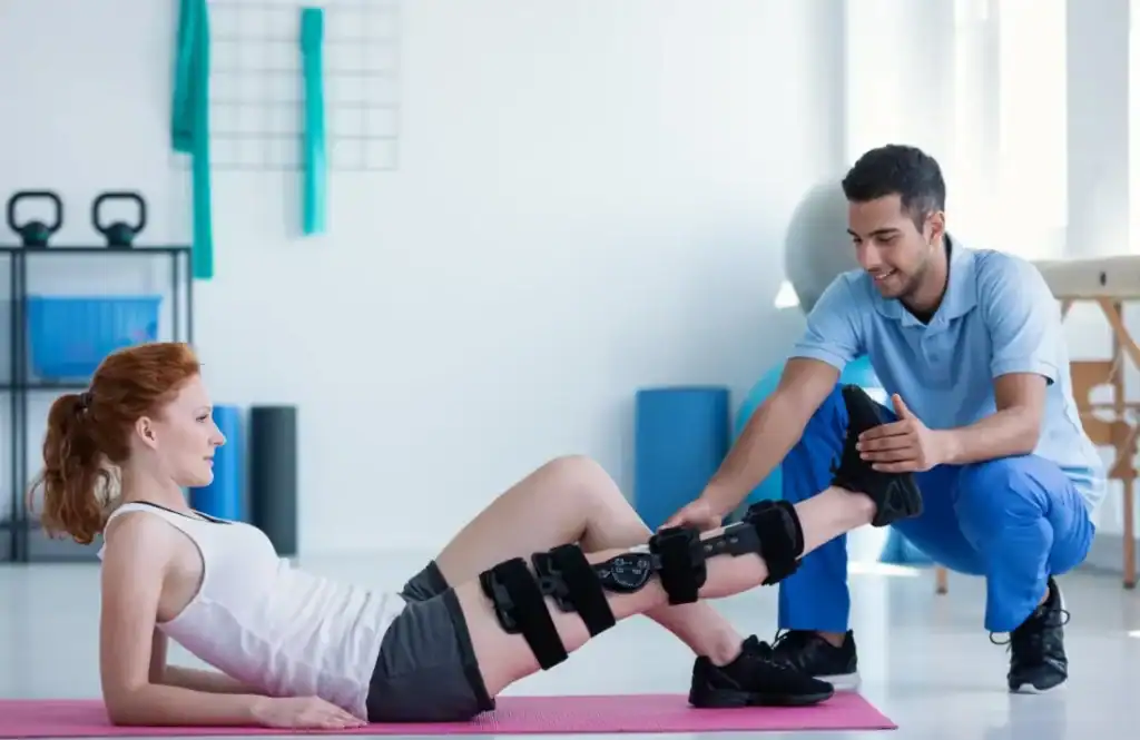 Woman having treatment to help muscle recovery East Kilbride after an injury
