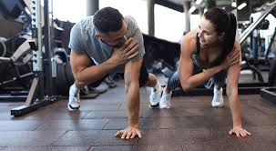 Image of man and woman doing Cardio East Kilbride to tone their arms. 